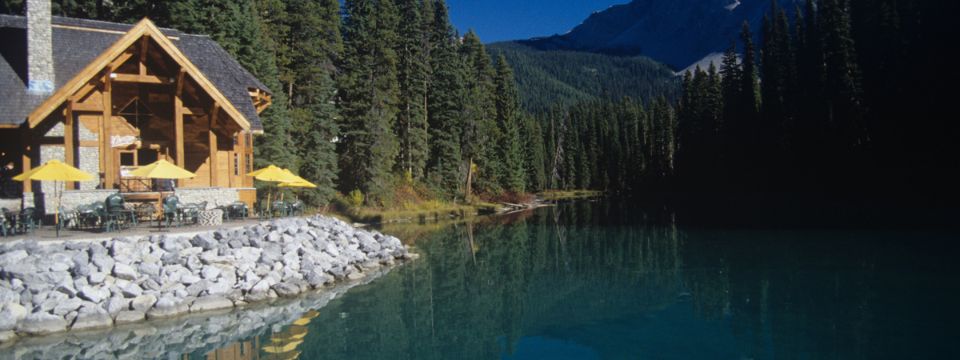 a house in front of a lake